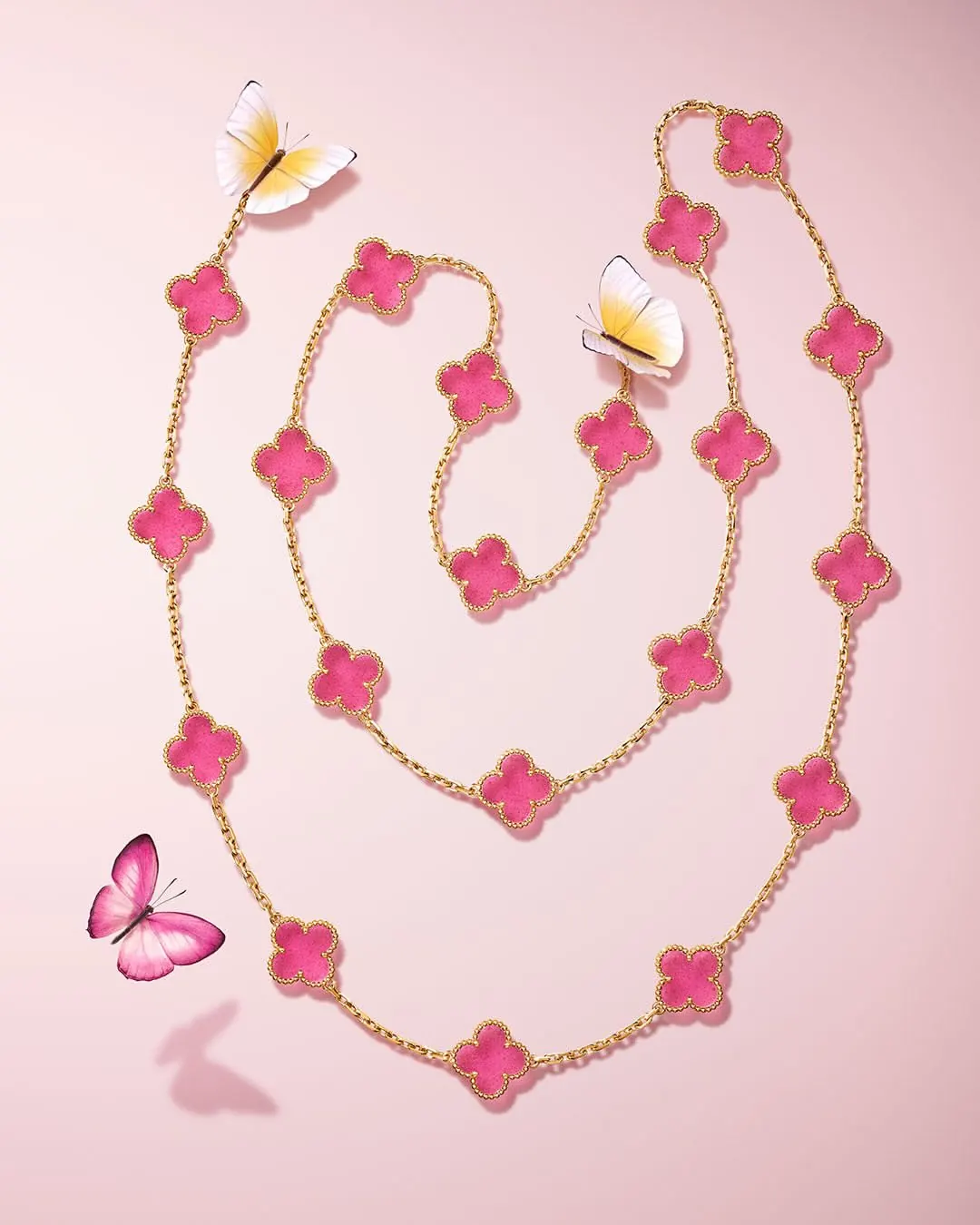 Van Cleef and Arpels Magic Alhambra two-motif earrings in pink enamel and yellow gold