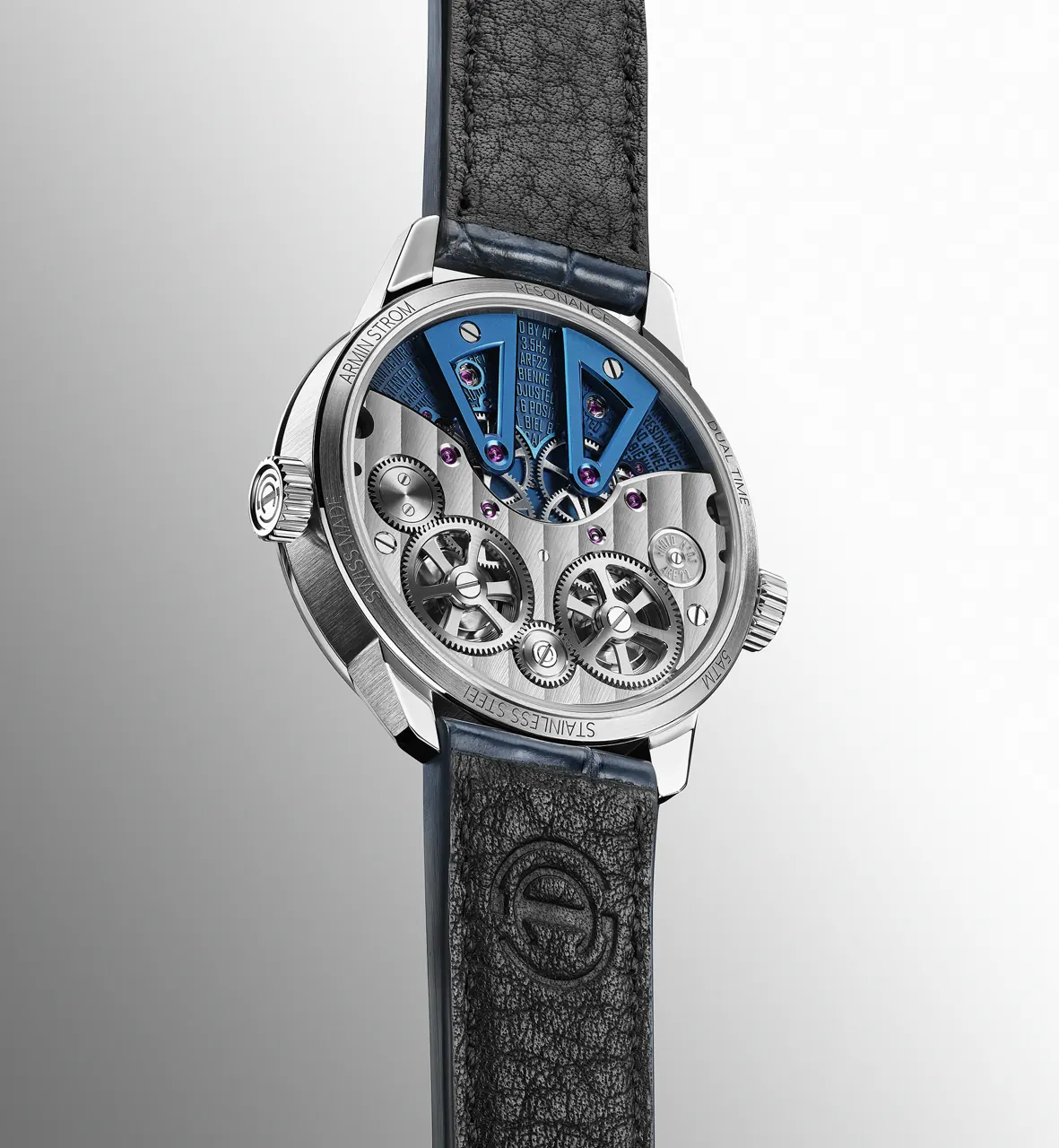 Armin Strom Dual Time GMT Resonance Blue on matte dark blue alligator strap with white stitching