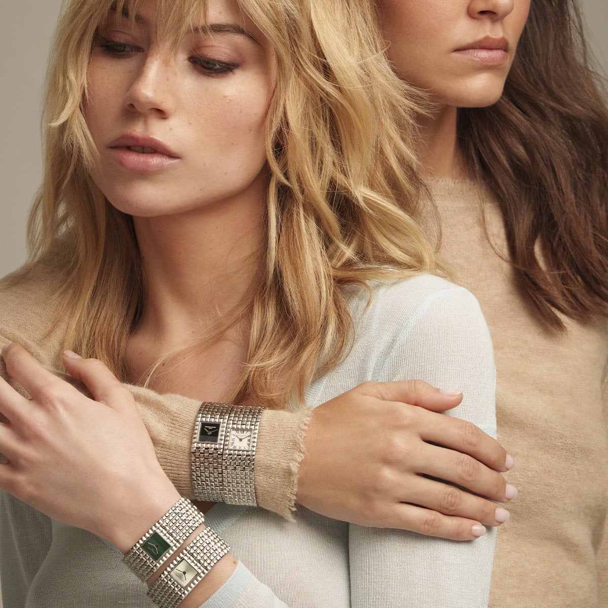 Two women wearing Frederique Constant Classics Manchette cuffs, official image