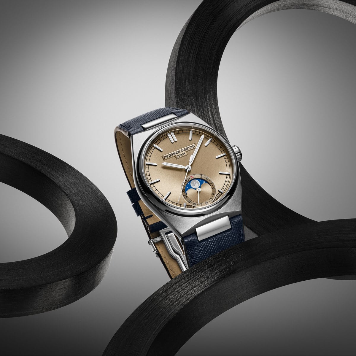 Frederique Constant Highlife Moonphase Date Manufacture with rosé-champagne dial on blue Saffiano strap, official press image
