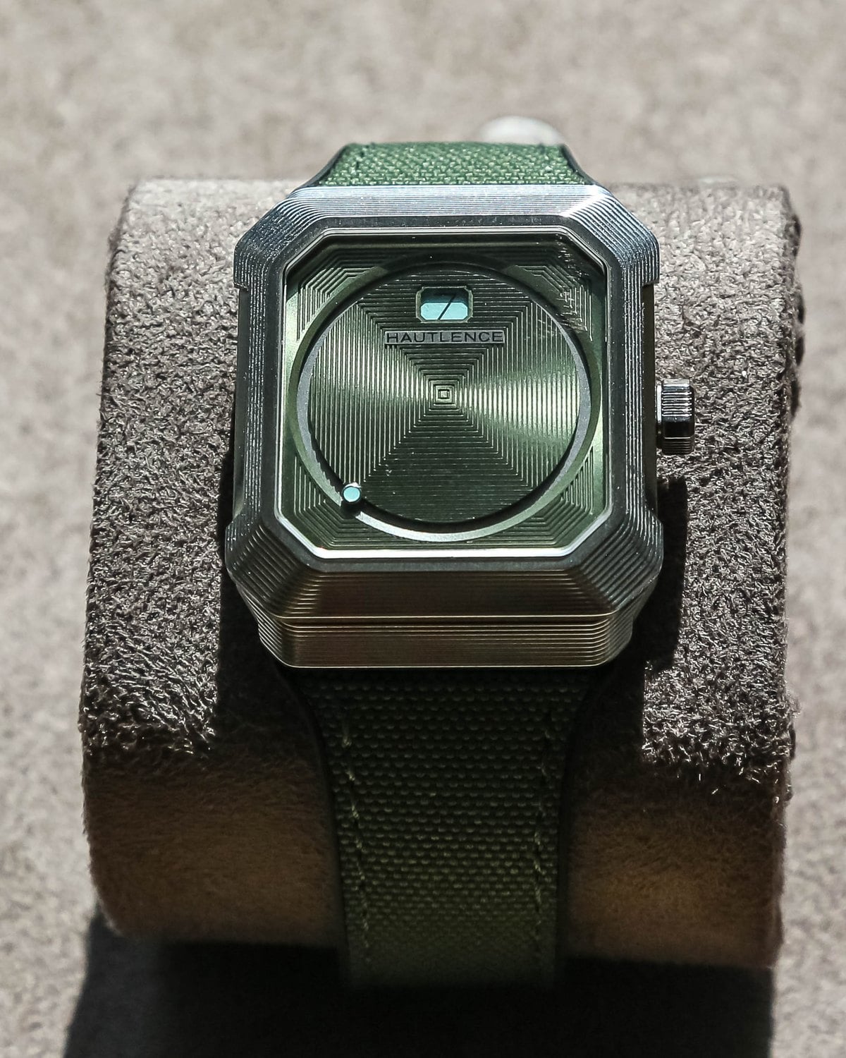 Hautlence Kubera Series 1 with green strap on a cushion at Geneva Watch Days 2026
