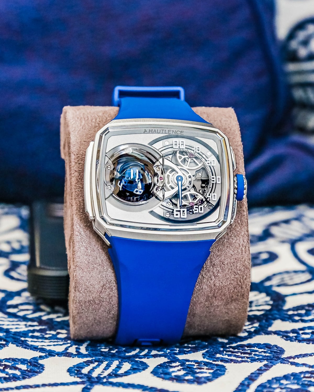 Hautlence Sphere on a blue strap resting on a cushion at Geneva Watch Days 2026