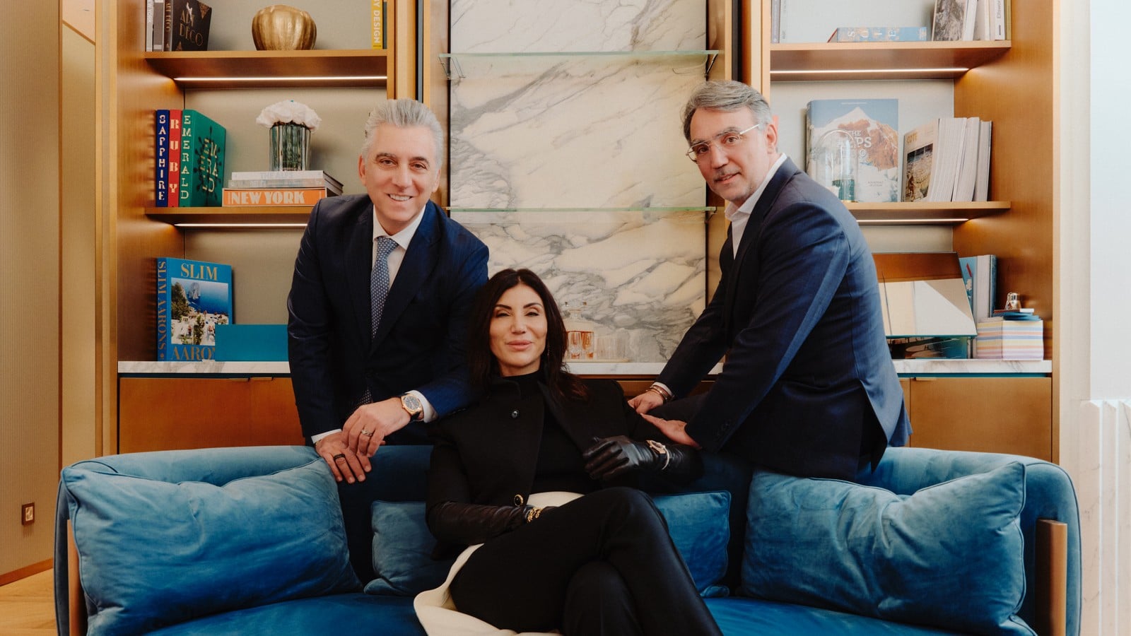 Maral Artinian, founder and creative director of MARLI New York, with members of the Artinian family on a blue velvet sofa, official image
