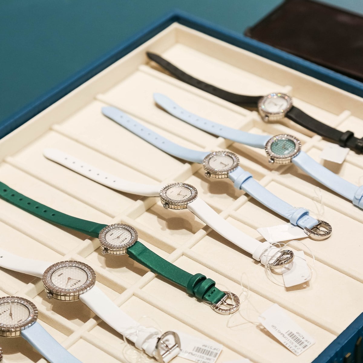 Marli timepieces with interchangeable straps in white, green and sky blue