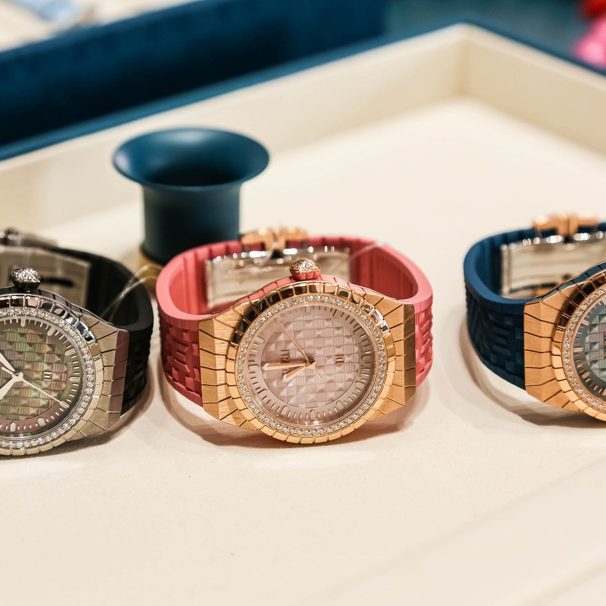 Three Marli timepieces in steel, rose gold and rose gold with diamonds
