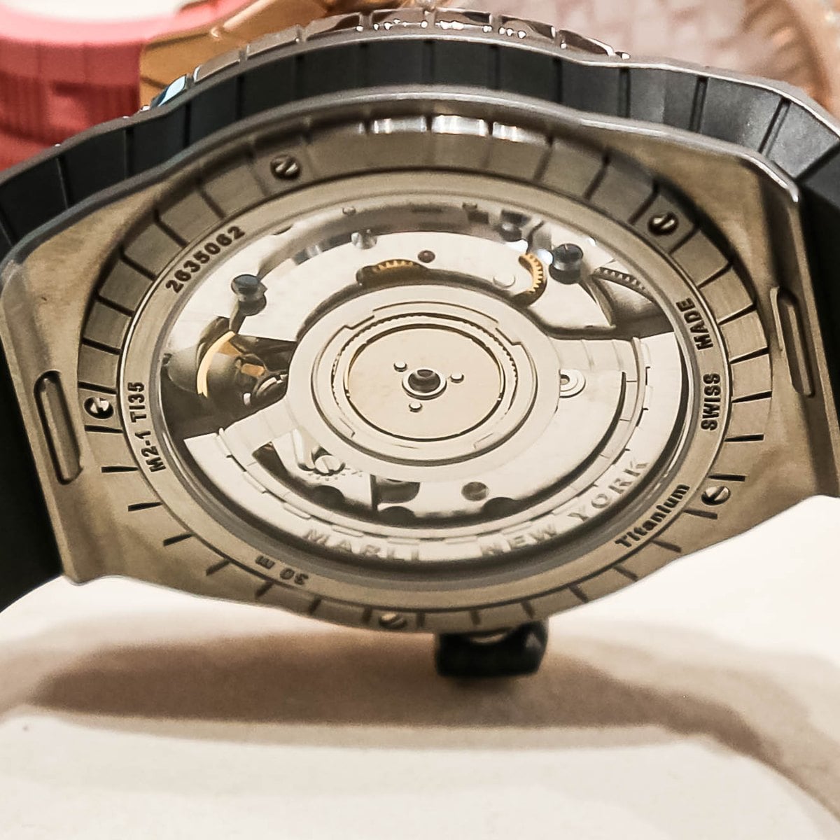 Marli L35 automatic caseback with open-worked rotor and Cotes de Geneve
