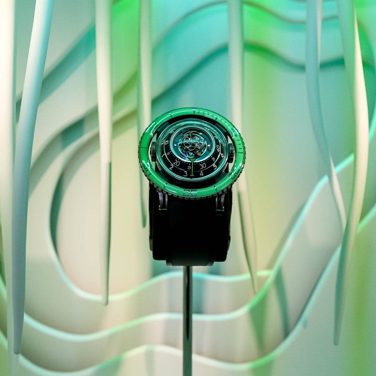 MB&F Horological Machine with green sapphire in a sculpted display at Geneva Watch Days 2026