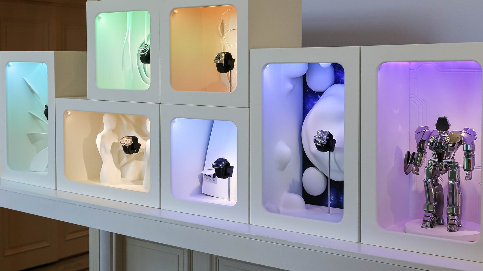 MB&F stand at Geneva Watch Days 2026: illuminated display boxes with Horological Machines and the HM robot