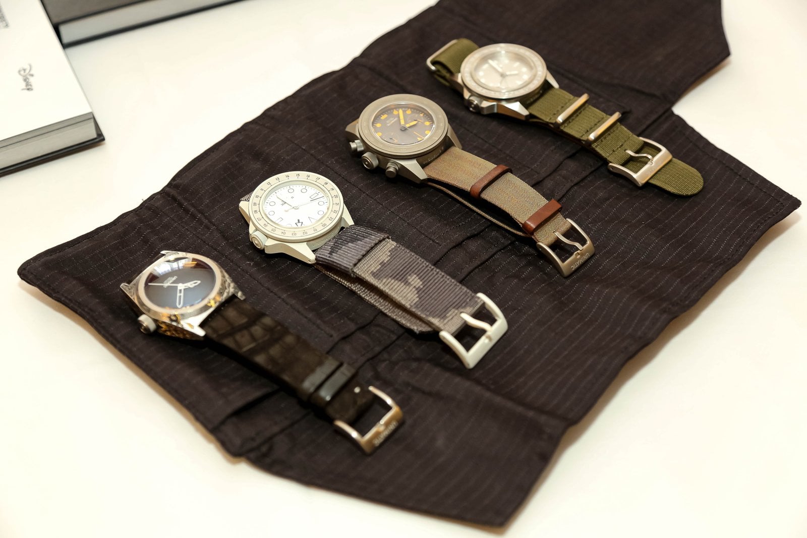 Four Unimatic watches in a black watch roll at Geneva Watch Days 2026
