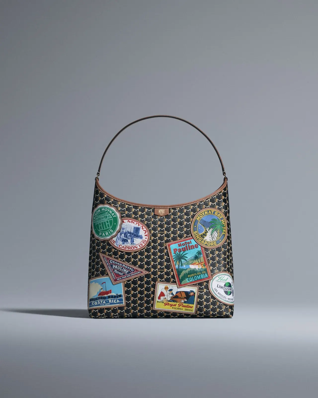 Moynat Hôtel collection bag detail showing travel-inspired design