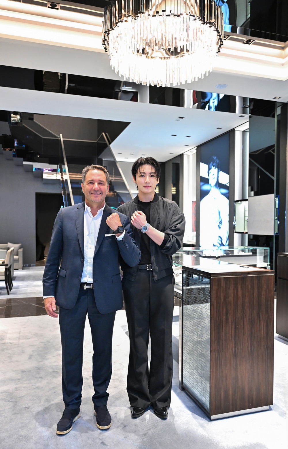 Hublot CEO Julien Tornare and Jung Kook inside the Hublot Ginza Boutique