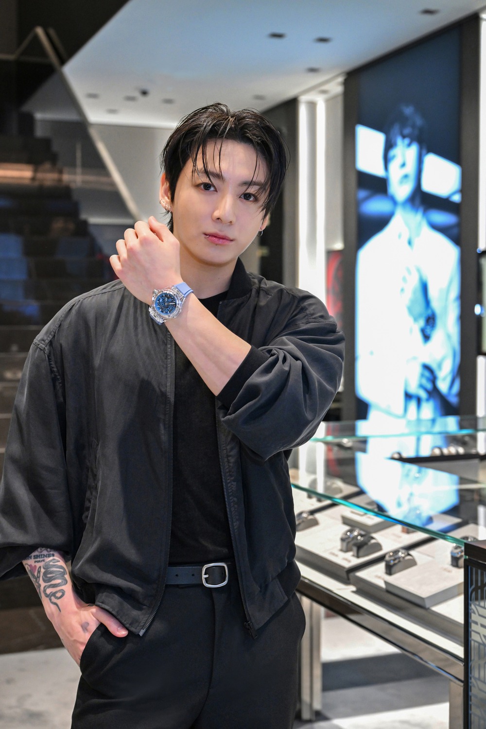 Jung Kook, Hublot Global Brand Ambassador, inside the Hublot Ginza Boutique with a Hublot on his wrist