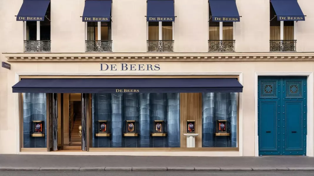 De Beers jewellery boutique facade with navy awnings and the De Beers name above the entrance